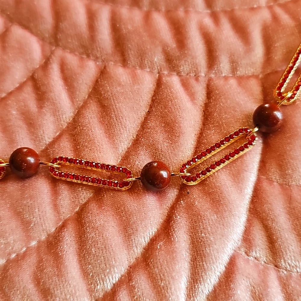 New goldtone with red crystal paperclip necklace with red jasper bead stations